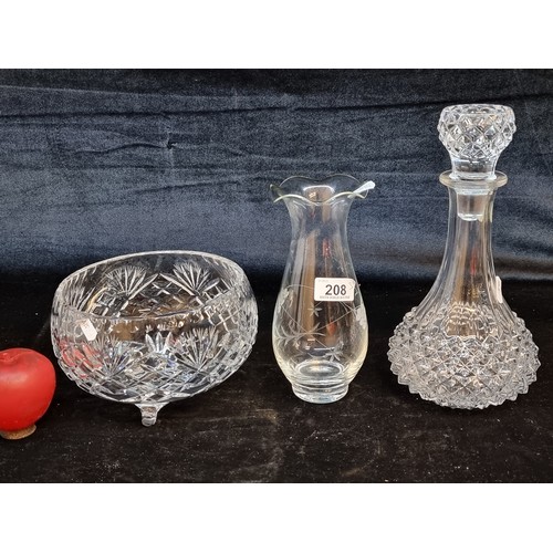 208 - Three pretty glassware items including a footed centrepiece bowl, a decanter with an original stoppe... 