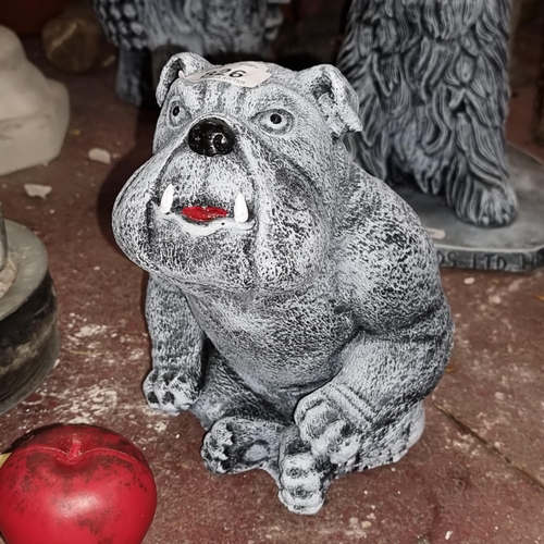 826 - A reconstituted stone garden figure of a Bulldog.