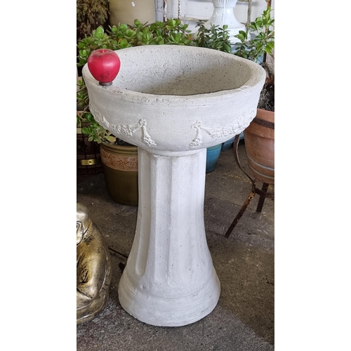 832 - Star Lot: A Neoclassical style reconstituted stone garden planter with a removable basin featuring a... 