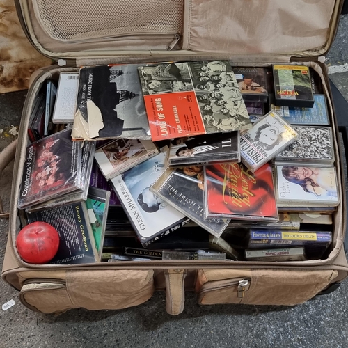 872 - A suitcase containing an extremely large collection of CD's, tapes and 7 inch vinyl records from var... 