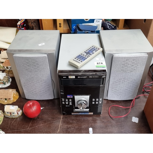 874 - A Sharp audio Micro Component system model XL-UH220H including player and two speakers. With Sharp a... 