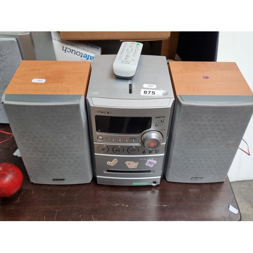 875 - A Sony HCD-NEZ3 sound system with a compact disc deck receiver and two speakers.