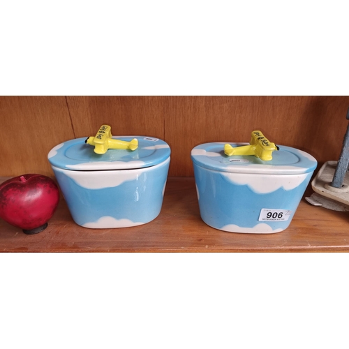 906 - Two unusual Utterly Butterly lidded ceramic dishes. With Bi-plane handles.