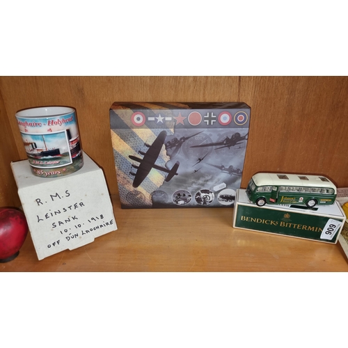 909 - Three items including a model plane, a commemorative mug for the R.M.S Leinster and a model tin bus.