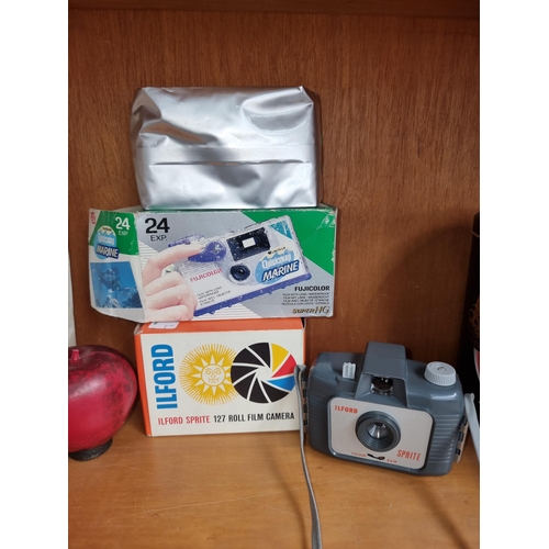 911 - Two retro in boxed cameras including a Fujicolor quicksnap marine and a Ilord Spirte 127 roll film c... 