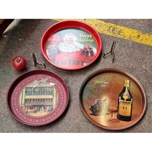 931 - A mixed lot of vintage items including three rare drinks trays along with two brass picture stands.