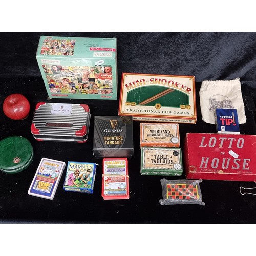 136 - A mixed lot of interesting items mostly comprising of games including mini snooker, top trumps and a... 