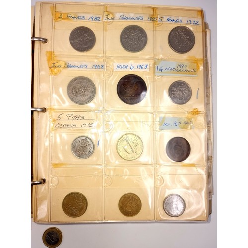 876 - A world coin album containing over 200 antique and vintage coins from all over the world, with many ... 