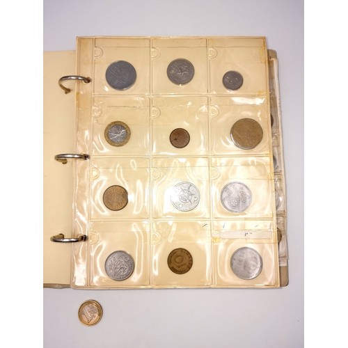 876 - A world coin album containing over 200 antique and vintage coins from all over the world, with many ... 