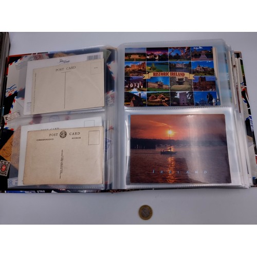 877 - A post card album bursting with over 160 post cards including many vintage and retro examples from p... 