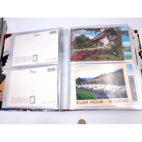 877 - A post card album bursting with over 160 post cards including many vintage and retro examples from p... 