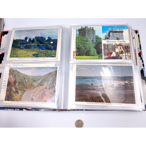 877 - A post card album bursting with over 160 post cards including many vintage and retro examples from p... 