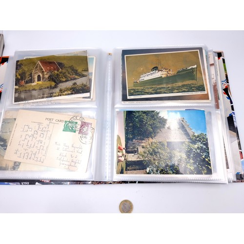 877 - A post card album bursting with over 160 post cards including many vintage and retro examples from p... 