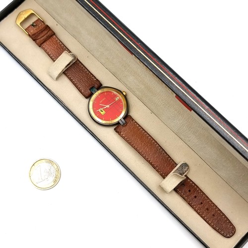 954 - Star Lot : A official Ferrari Formula 1 wrist watch by Cartier set with leather strap and presented ... 