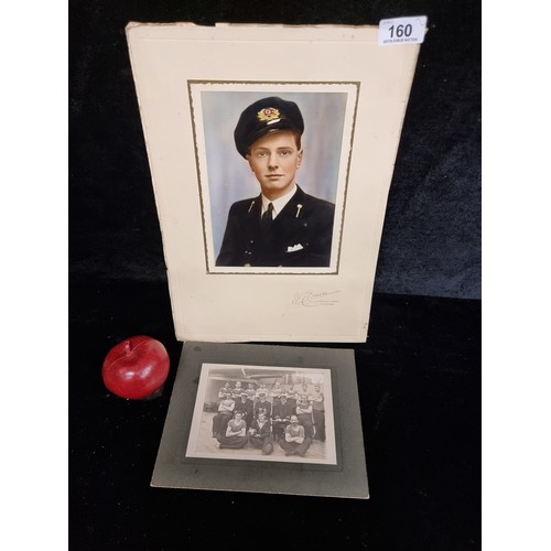 160 - Two vintage photographs of naval interest including a hand colourised portrait depicting a sailor in... 