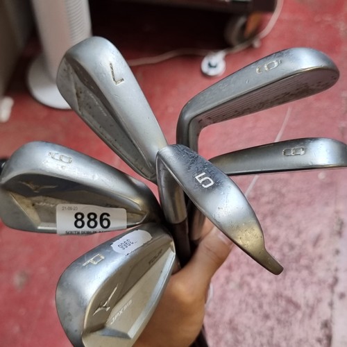 886 - Star lot : A set of Mizuno JPX 919 Tour Edition graphite shaft golf irons (5-9) along with a PW. All... 