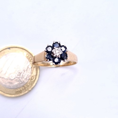 2 - Star Lot : A very attractive diamond and sapphire cluster ring set with a wide band. Ring size P. We... 