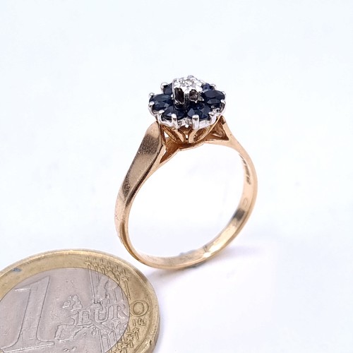 2 - Star Lot : A very attractive diamond and sapphire cluster ring set with a wide band. Ring size P. We... 