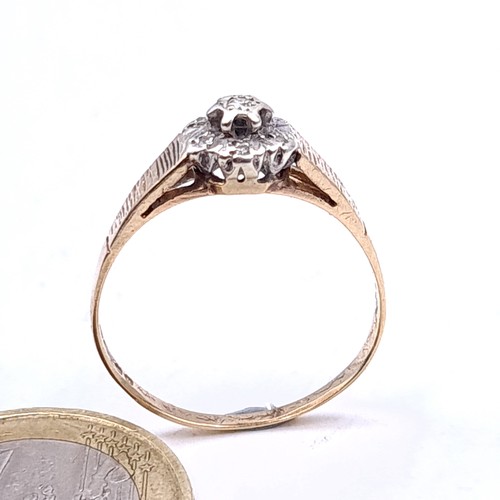 3 - An illusion set diamond ring in 9 carat gold with channel cut shoulders. Ring size Q. Weight 1.8g.