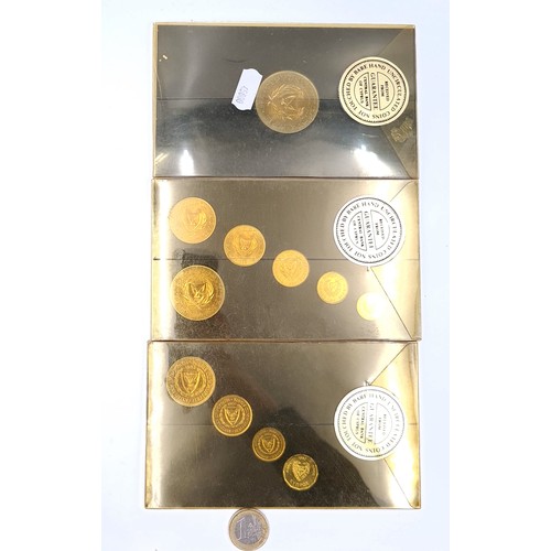 25 - A collection of 3 encapsulated sets of coins issued by the bank of Cyprus in mint and uncirculated c... 