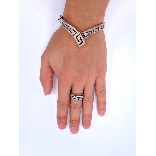 27 - Two sterling silver items both with Egyptian key design. Consisting of a bracelet and ring. Ring siz... 