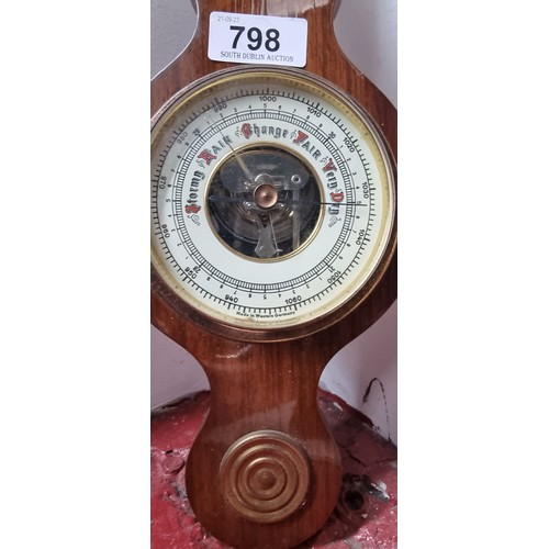 798 - A wall mounting barometer with thermometer to top. Made in West Germany.