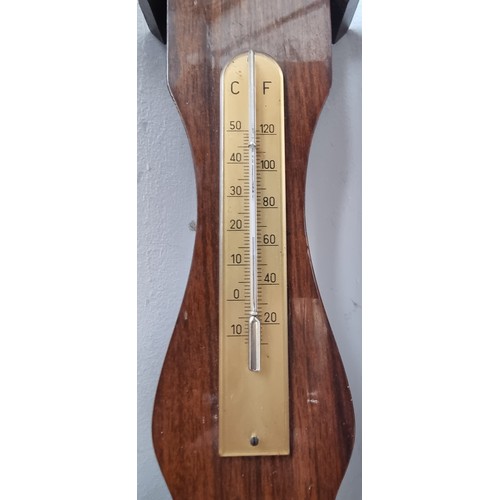 798 - A wall mounting barometer with thermometer to top. Made in West Germany.