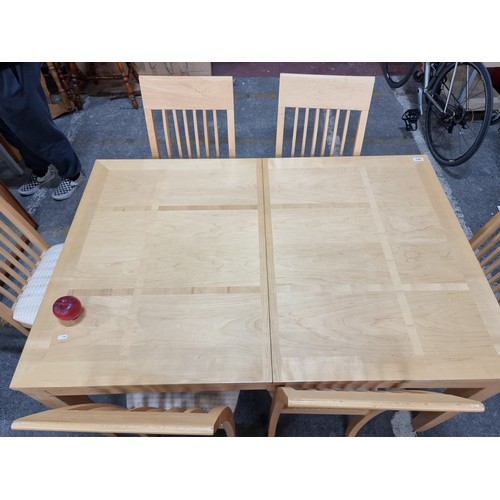 801 - A high quality solid maple dining table along with six additional matching chairs.
H76cm X W137cm X ... 