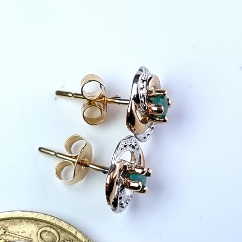 6 - A. very pretty pair of 9 carat gold emerald and gem set swirl stud earrings. Total weight 1.12 grams