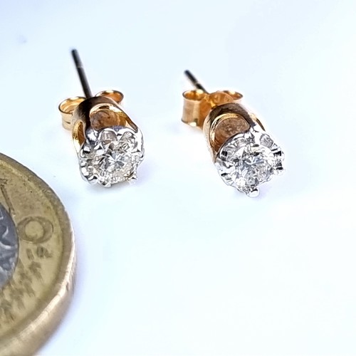 8 - Star Lot : A very pretty pair of bright cut diamond stud earrings set in 9 carat gold. Diamond diame... 