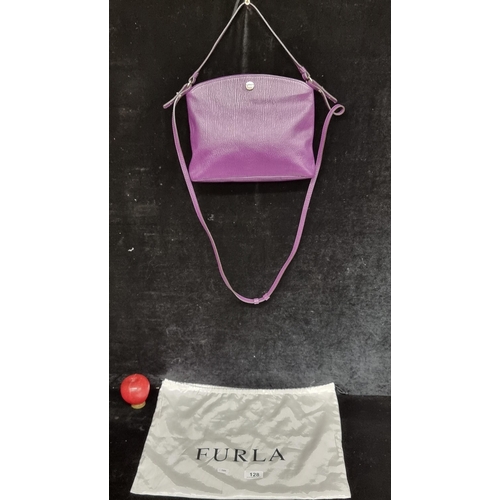 128 - Star Lot : A striking genuine leather Furla shoulder bag in a vibrant shade of purple. With a long a... 