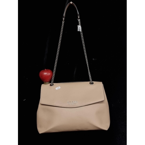 130 - A genuine Guess shoulder bag in the style EV 718020. In a beige finish with internal zip up compartm... 