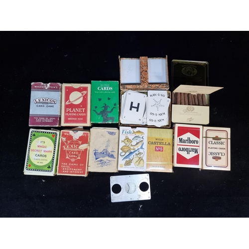 133 - Eleven vintage items including playing card packs along with two packs of cigars from Dannemann and ... 