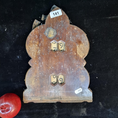 141 - A wonderful Victorian wooden scoreboard complete with original number discs that can be rotated to c... 