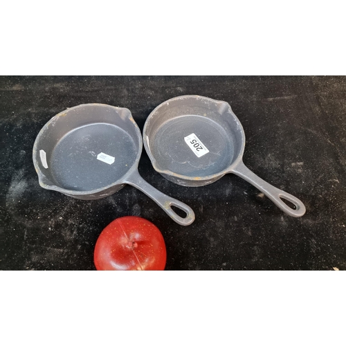 205 - A pair of neatly size very heavy cast iron Utopia skillets.