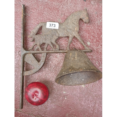 373 - An antique 19th century  cast metal wall mounted bell, featuring a quaint horse group to top. Bell m... 