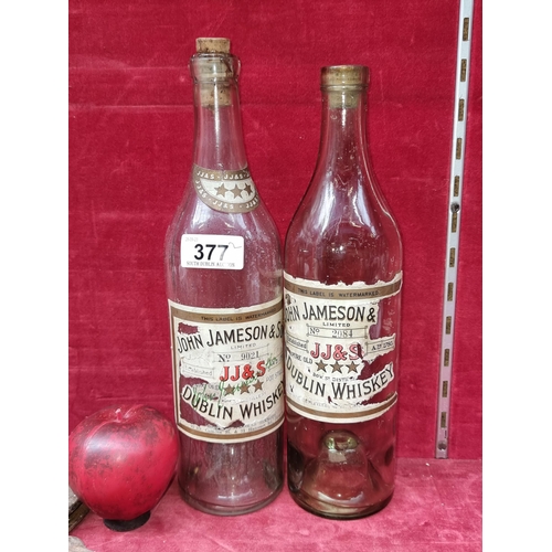 377 - A collection of two vintage display bottles, both for Jameson & Sons Irish Whiskey and featuring fab... 