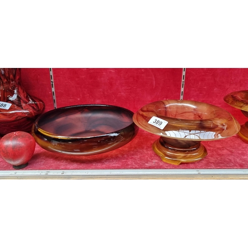 389 - A collection of two items, including a hand blown Art Deco Smokey Glass amber rolled rim fruit bowl,... 