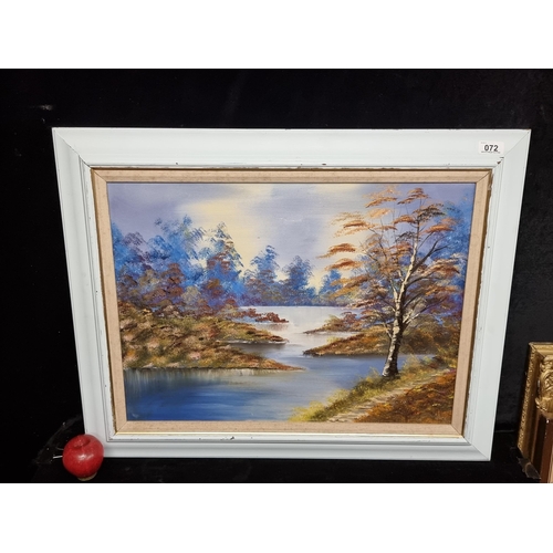 72 - A large original oil on canvas painting featuring a landscape scene of a lush lake lined with silver... 