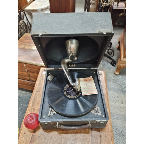 719 - A wonderful antique Columbia Records gramophone held in a black hard shell travel case. Along with a... 