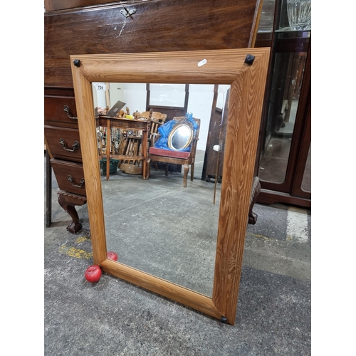 734 - A handsome large pine beveled mantle mirror.