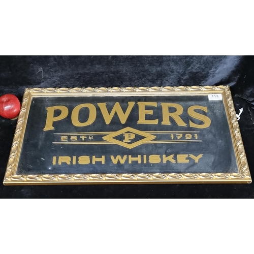 113 - A very heavy pub / bar mirror advertising Powers Irish Whiskey with beveled mirror held in gilt wood... 