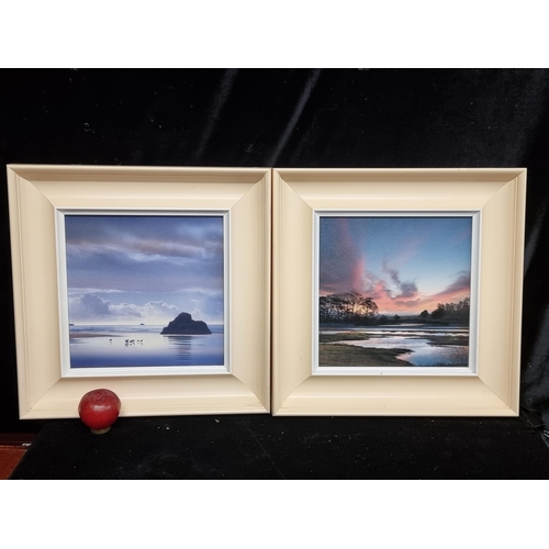 123 - A pair of high quality prints on board of landscape photographs, held in high quality cream frames.