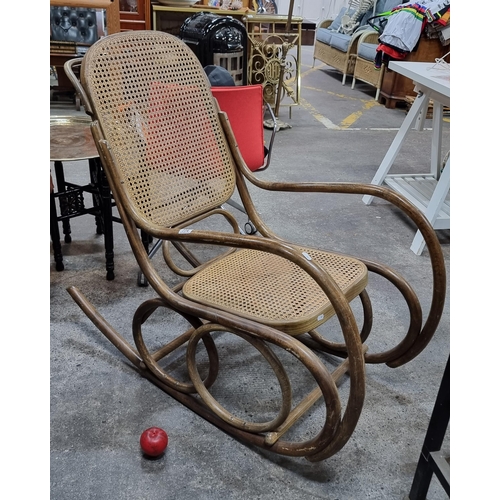 774 - A fabulous large Thonet-style bentwood rocking chair with rattan seat and back.