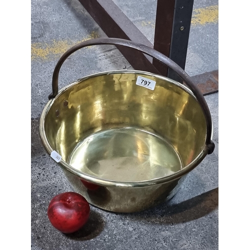 797 - A large antique brass Preserve pan with a handle featuring copper studs. Very heavy and beautifully ... 