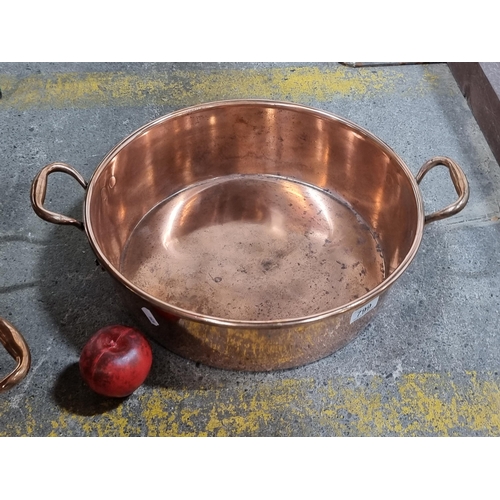 799 - A very large antique heavy copper preserve pan with two handles. Professionally cleaned.