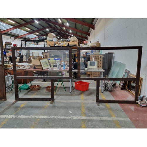 810 - A pair of pub/restaurant table dividers with clear plastic screens and wooden frames. H150cm x L155c... 