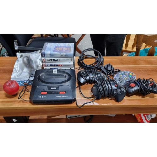 823 - Ten gaming console equipment including 16-bit Mega Drive II cartridge console along with a Sega cont... 