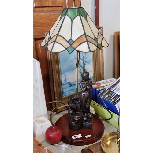 858 - An elegant Tiffany style table lamp with a brass stem and base in the form of a woman collecting wat... 