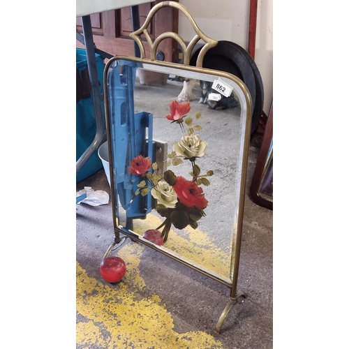 862 - A beautiful vintage fire screen with a bevelled mirror panel featuring a handpainted floral motif. H... 